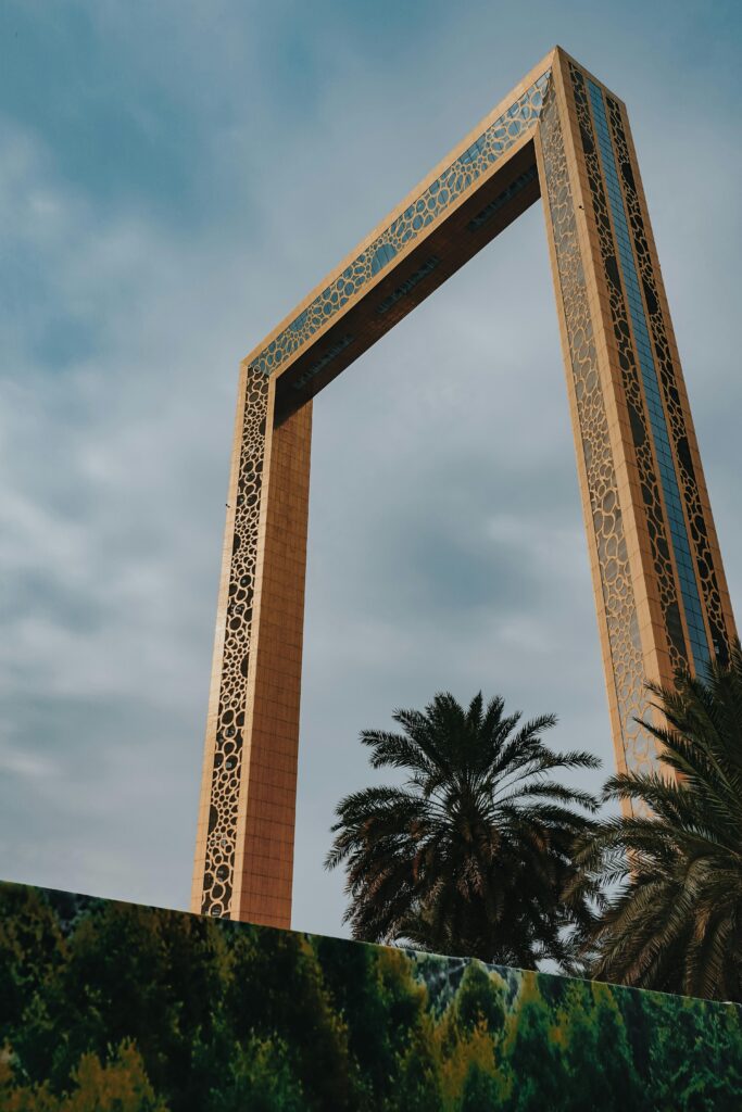 From below exterior of creative contemporary construction build in shape of rectangular photo frame in Dubai UAE on clear hot day